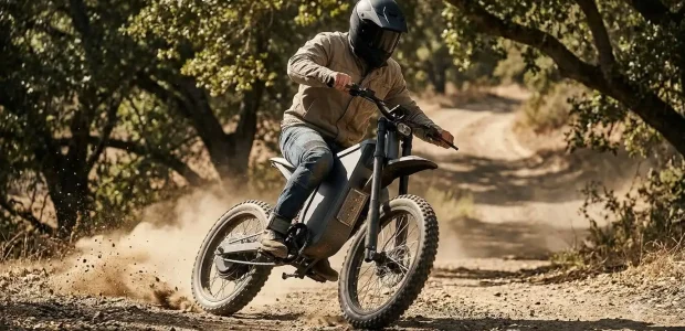 Rider on a gray electric dirt bike kicking up dust on a trail, Freego X2 Pro vs Juiced Nomadix comparison
